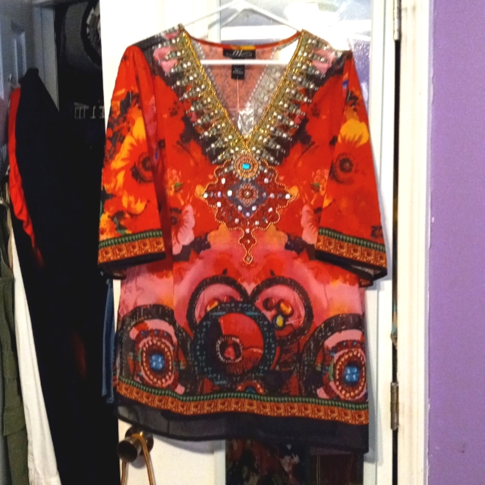 This beautifuTunic..(never worn)similar to the one in the last photo